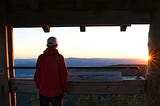 Man looking at sunrise by Matthias Münning on Unsplash