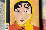 Portrait of a woman in yellow headscarf and orange jacket