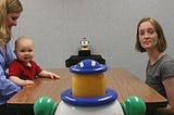 Photo caption: A 1-year-old baby follows the eye gaze of Rechele Brooks, of I-LABS, as she turns her head to look at a toy.