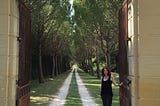 Author at the gate of a chateau in France