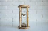 Clear hourglass in a brown frame