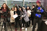 Video professional Mary Jo Brooks on the left in a classroom of University of Colorado students learning how to use professional videography equipment. The class is a diverse set of students from three different countries.