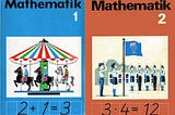 Covers of grade 1 and 2 math textbooks from the former GDR which include pictures of a carousel and of a roll call.