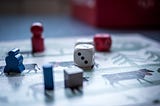 Image of dice and board game.