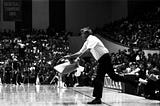 Basketball coaching legend Bob Knight throwing a chair during a basketball game.