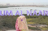 “UM AL NAAR” is spelled in 3D lavender lettering behind the titular character of Um Al Naar.