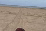 Football on the beach. Photo by Mark Tulin