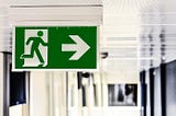 Emergency exit sign with arrow pointing right