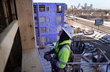 Carpenter Paul Olson, a new apprentice in construction, works to install exterior sheet rock on an apartment complex in Minneapolis, Minnesota, March 14, 2023. Photo by Anthony Souffle/TNS/ABACA via Reuters