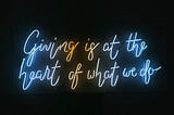Neon sign found in one of the meeting rooms at the Charitable Impact office which reads: ‘Giving is at the heart of what we do’. Photo taken by Anneliese Herbosa.