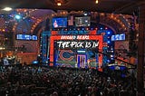 The Chicago Bears, owners of the first pick in the 2024 NFL Draft, are shown making a selection in a previous draft.