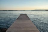 View from a wooden pier looking out to sea in Cagliari, Sardinia