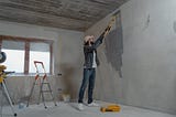man remodeling a home