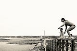 Photo of me standing on the rail at Second Bridge about to jump into the channel between Segenkontacket Pond and State Beach