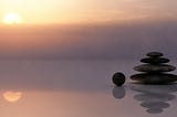 Stones balancing on the beach to demonstrate that everything is in a balanced state