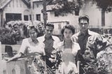 A family whose house was looted by Indonesian men during the conflict.