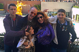A family of five at the Rockerfella Icerink in New York. Laughing and messing around.