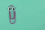 Purple paperclip with eyes.