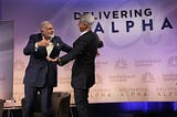 Bill Ackman hugs Carl Icahn at a hedge fund conference