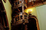 Wooden spiral staircase inside the Peles Castle, Romania