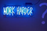 Work harder neon sign | Image adapted from Unsplash | Jordan Whitfield @whitfieldjordan