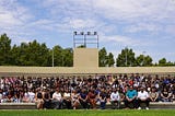 A large group shot of facilitators and students of Valley-Bound Commitment sitting at the Greek Theater