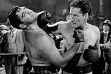 ‘GENTLEMAN JIM’: Errol Flynn’s Swashbuckling Knockout Put Robin in the Ring
