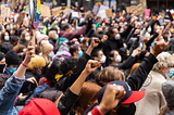 Protestors raising their fists