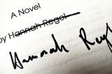 An autograph with crossed-out printed name.