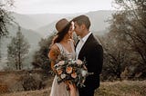 A bride and a groom outdoors.