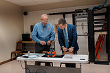 Joe Gambill, Training Director of SBJATC, performs a demonstration for Secretary Buttigieg