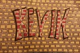 Graffiti made inside a grey and yellow designed background