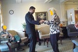 A picture of me in my naval uniform, dancing with one of the ladies at the nursing home.