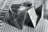 origami shape made from newspaper
