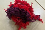 What does red wool have to do with displaced people?