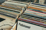 A bin of record albums as they were in the 1960s. Feliciano! is visible.