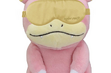 A slowpoke wearing a Taylor Swift branded sleep mask and matching earplugs.