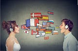 Man and woman communicating, various flags between them