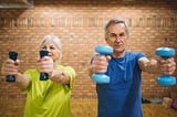 Seniors training with dumbbells