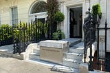 sesame access systems wheelchair lift at the front of a house for their front door access.