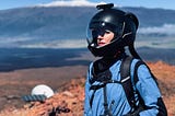 Hillary Coe dressed in a space suit for an analog Mars mission