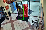 1 of 2 people entering a fitness club is detected as unauthorized as shown in the red bounding box.