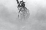 Photo of the Statue of Liberty enveloped in fog