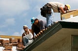 Roofing professionals at work.