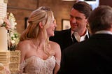 Casey (Jesse Spencer) smiles at Brett (Kara Killmer) after their wedding on Chicago Fire