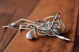 How tangled earbuds tell a story on society.