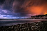 a-storm-rolls-in-over-a-rocky-beach