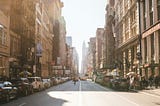 New York City street with shops and cars