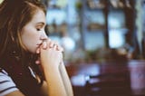 Photo of woman in deep thought and eyes closed