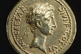 A gold aureus of Augustus that depicts the start of the Roman empire